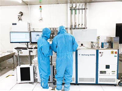 Researchers conducting compound semiconductor process experiments in a micro-nano lab
